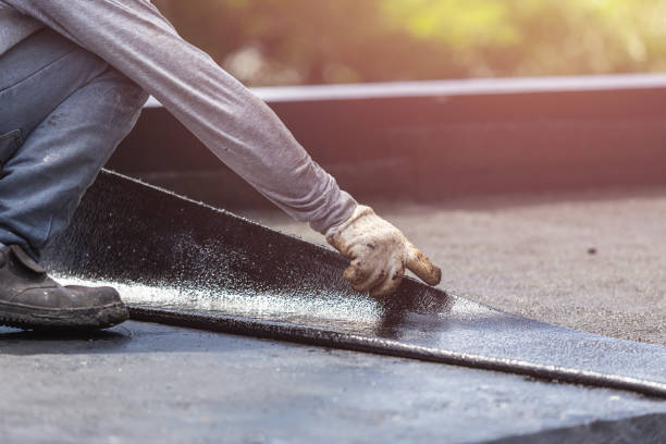 Professional Emergency Waterproofing technician working in Lake George, MI
